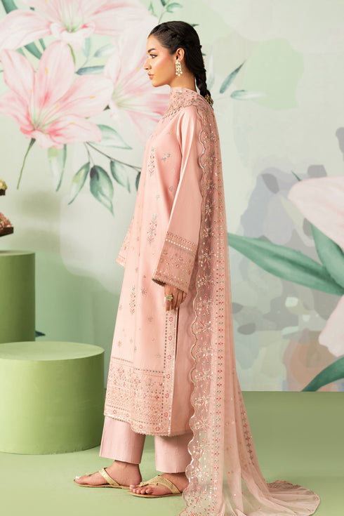Woman in a pink traditional outfit with floral background